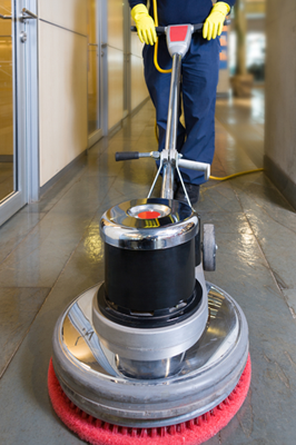 Industrial buffing machine polishing the floor in a hallway